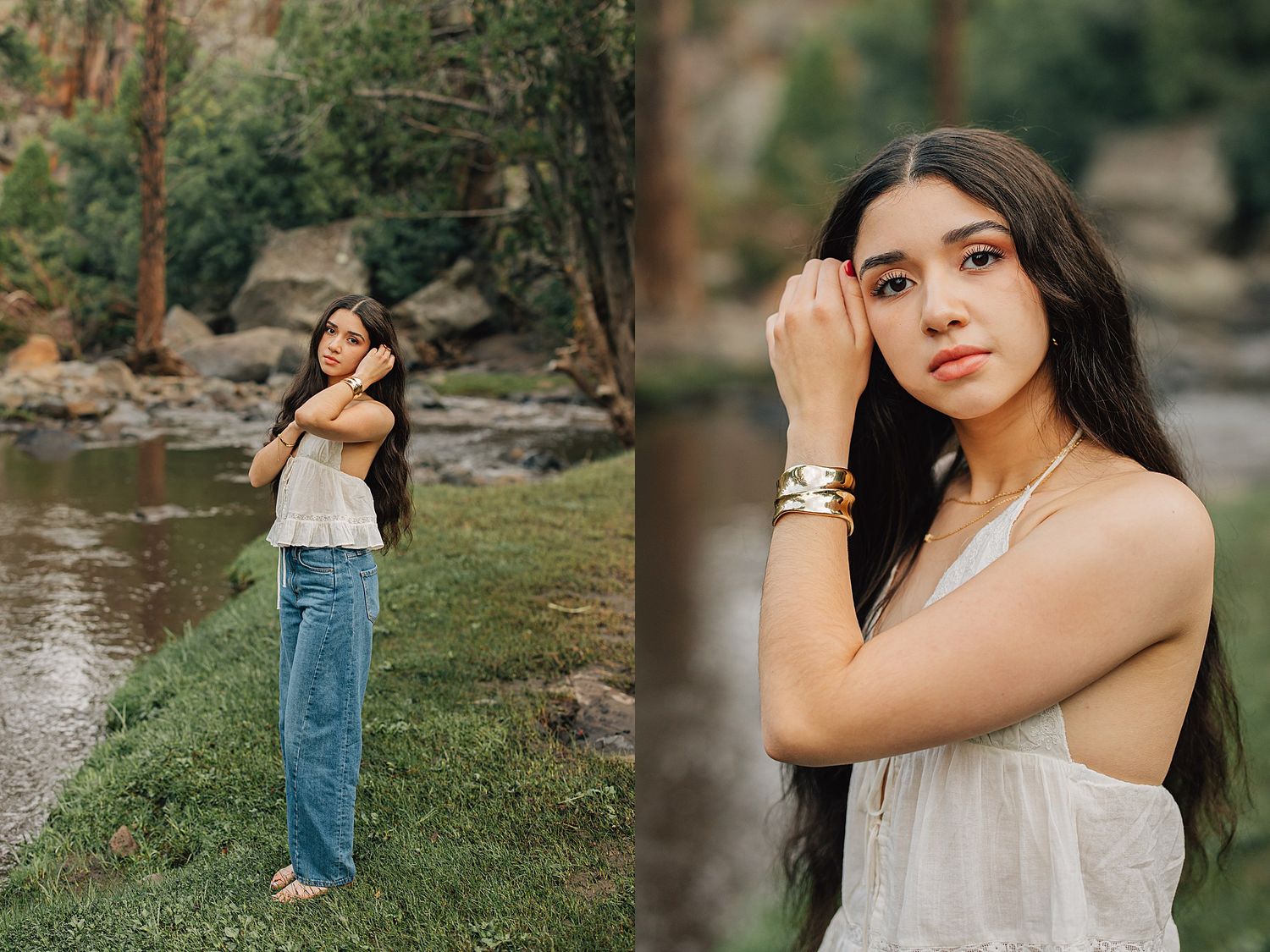 Young woman in white top and jeans poses by a rocky creek, showcasing bracelets and long dark hair outdoors.
