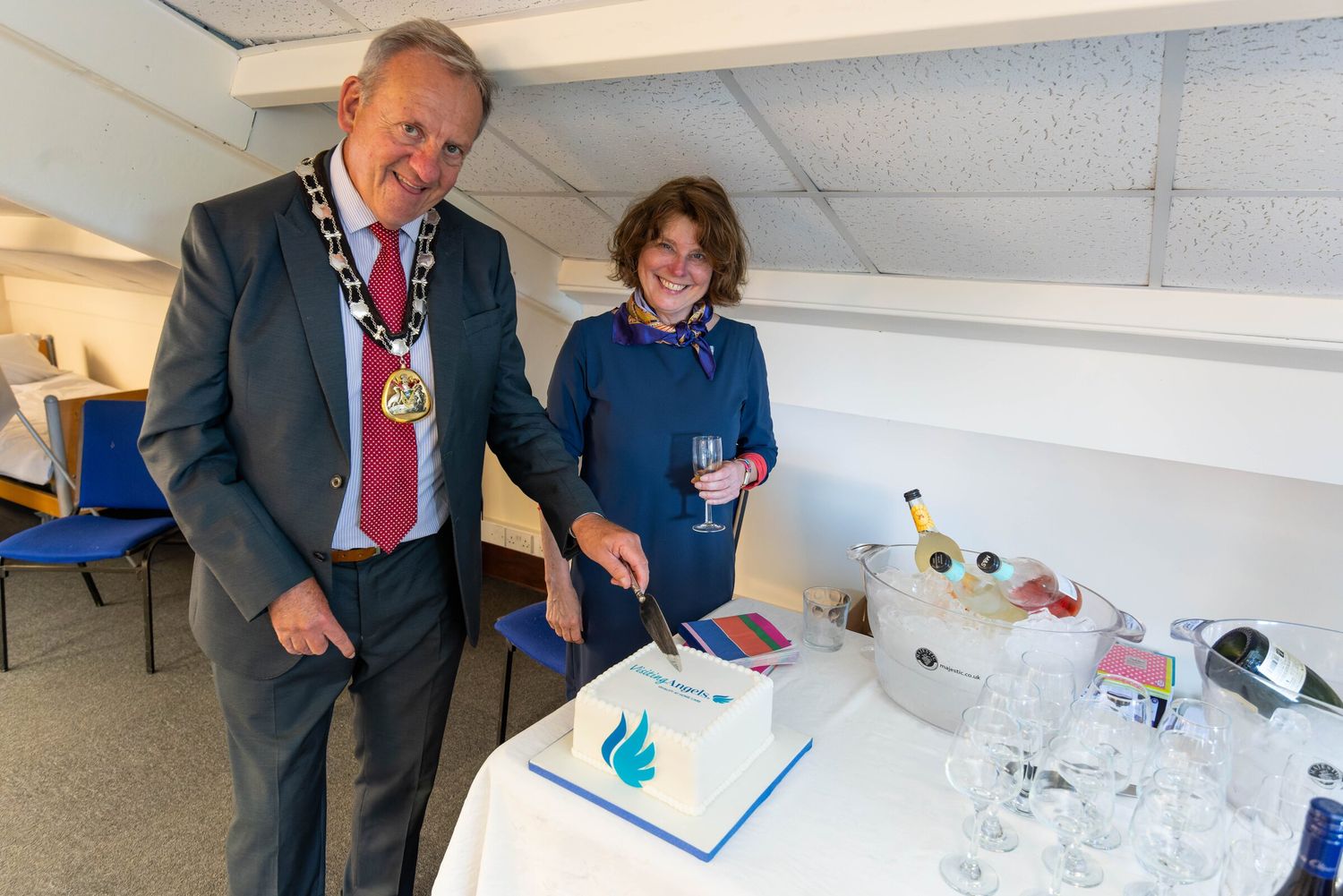 The Mayor of Tunbridge Wells cutting a celebration cake at a community event
