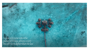 Aerial view of a luxury overwater bungalow resort in turquoise waters, promoting a serene wellness retreat destination.