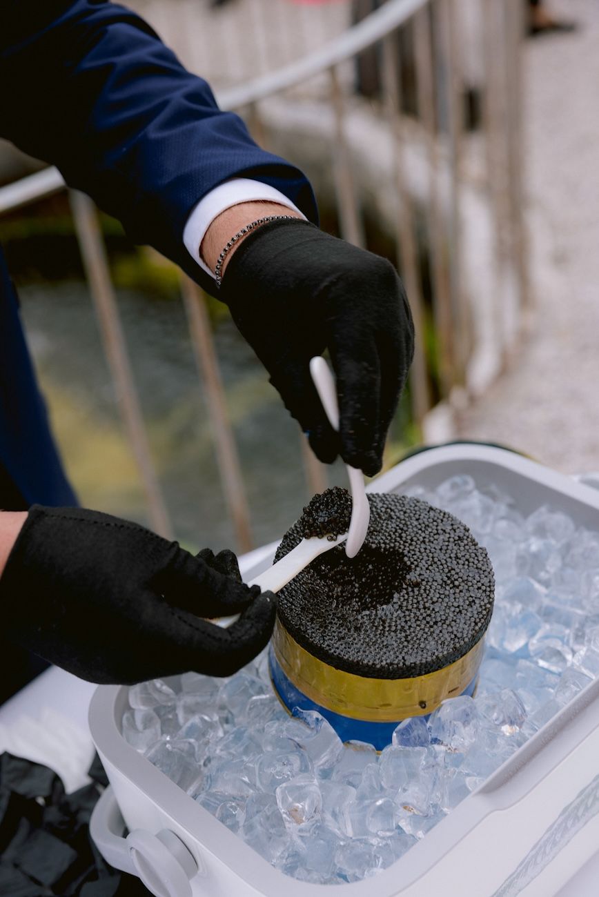 Caviar experience during the cocktail time of a destination wedding at Villa Bettoni, Lake Garda. Italy.
