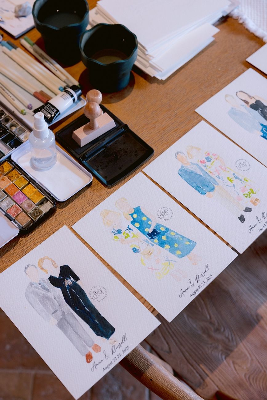 Live painter making personalized portraits of the guests during the rehearsal dinner in the vineyards near Lake Garda, Italy