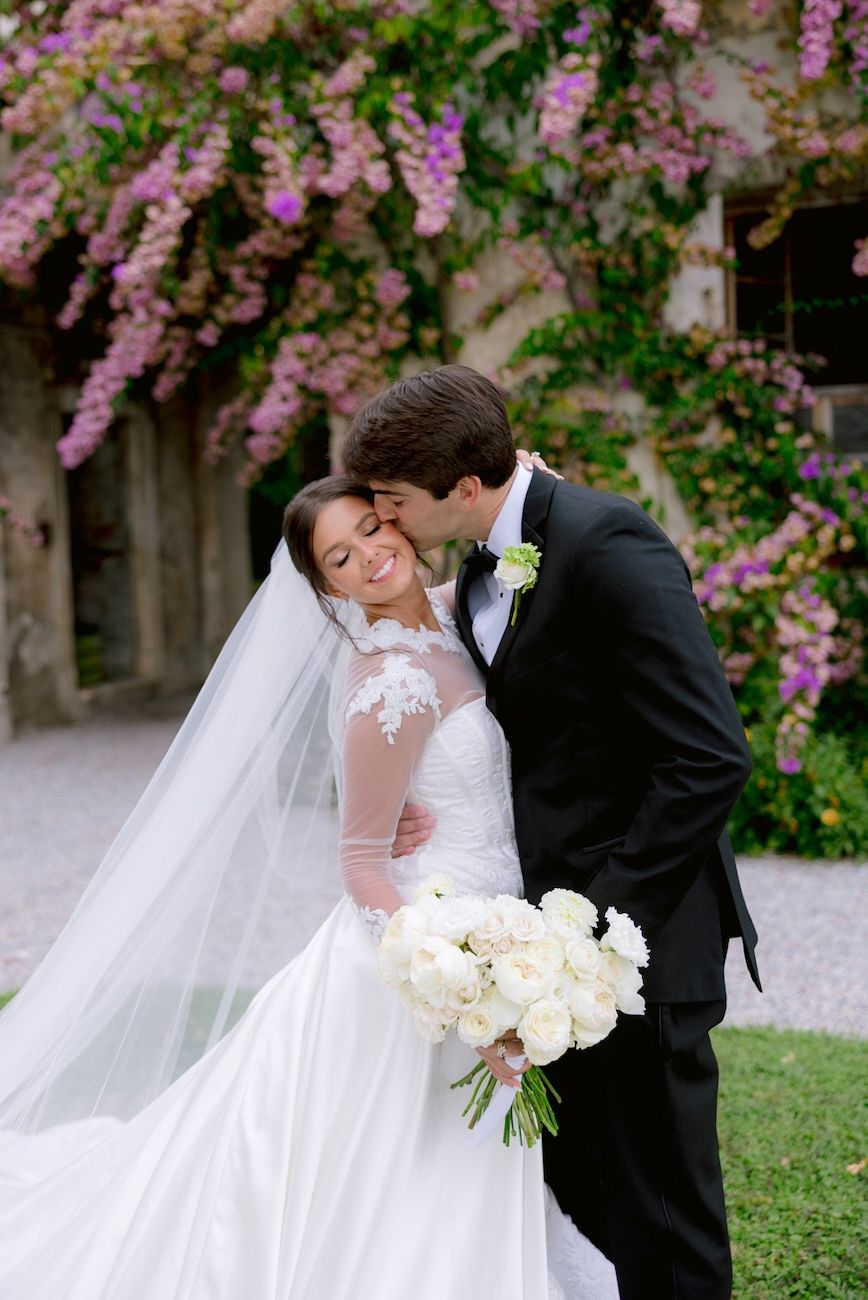 Portrait of bride and groom in the gardens of Villa Bettoni, Lake Garda. Italy.
