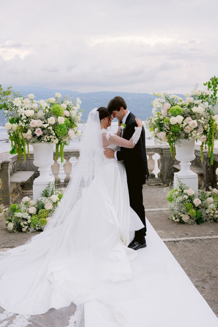 Portrait of bride and groom at their wedding ceremony on the terrace of Villa Bettoni, Lake Garda. Italy. design by Solidea Events