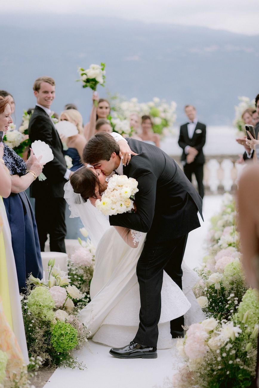 Portrait of bride and groom at their wedding ceremony on the terrace of Villa Bettoni, Lake Garda. Italy. design by Solidea Events