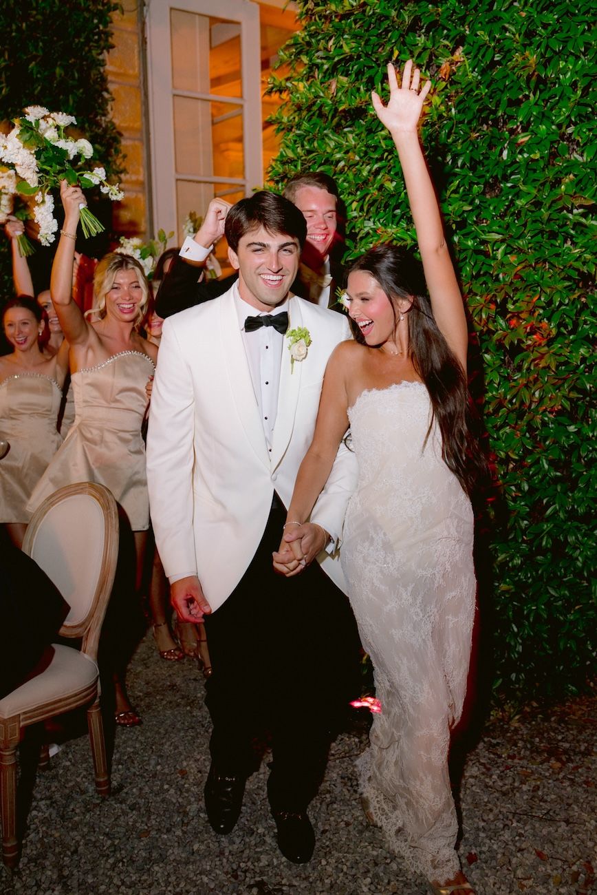Cheerful bride and groom starting the party of their destination wedding at Villa Bettoni, Lake Garda, Italy.