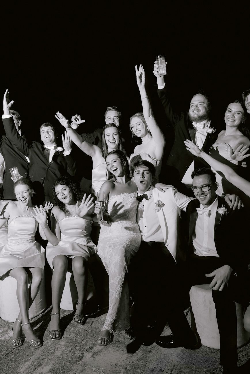 Group photo of guests and couple during the party of a destination wedding at Villa Bettoni, Lake Garda, Italy