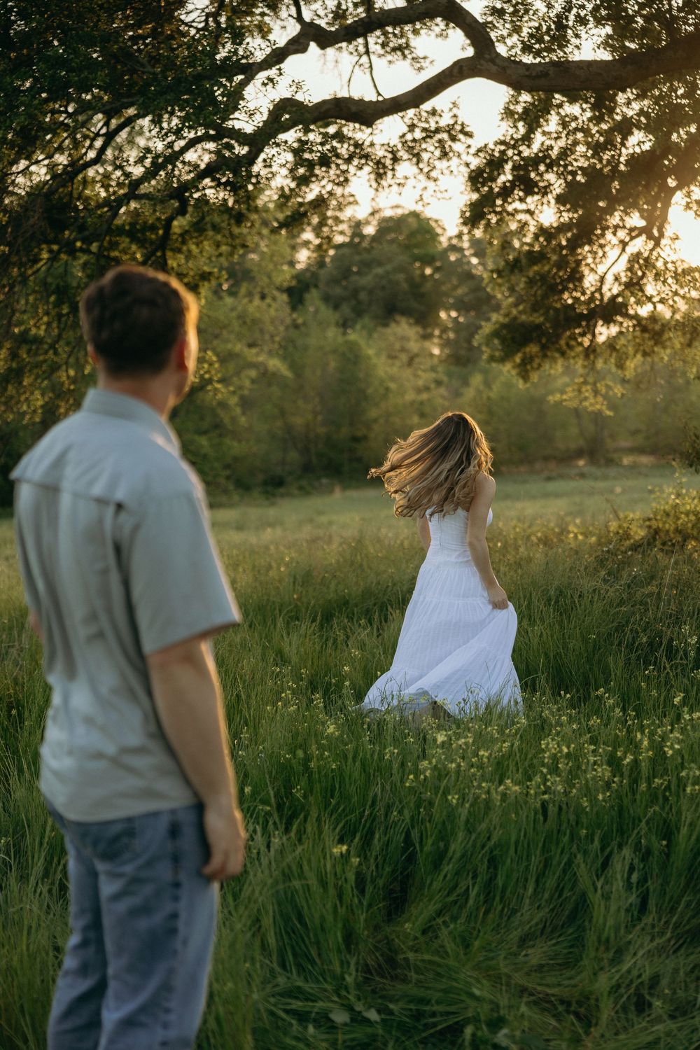 Couple in a sunlit meadow at golden hour in Atlanta, Georgia.