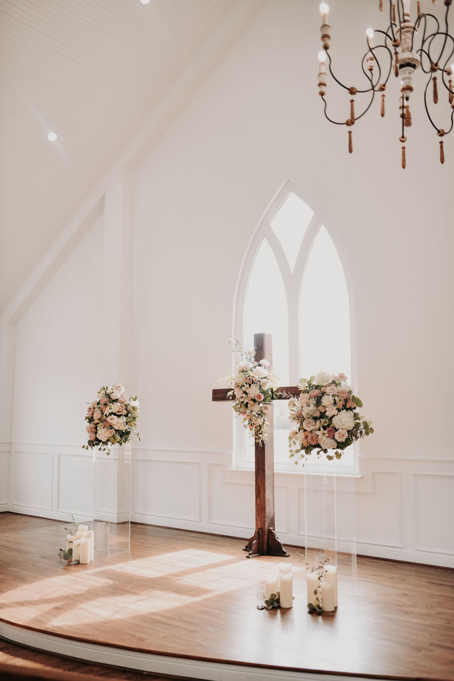 The White Sparrow chapel aisle lined with oversized romantic floral arrangements
