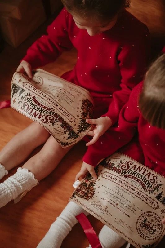 Children holding Christmas letters during a previous festive photography session.
