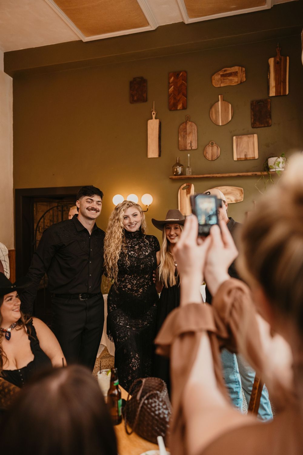 Bride and Groom with friends at their wedding welcome party in Livingston, Montana for their welcome party in Paradise Valley - Photographer