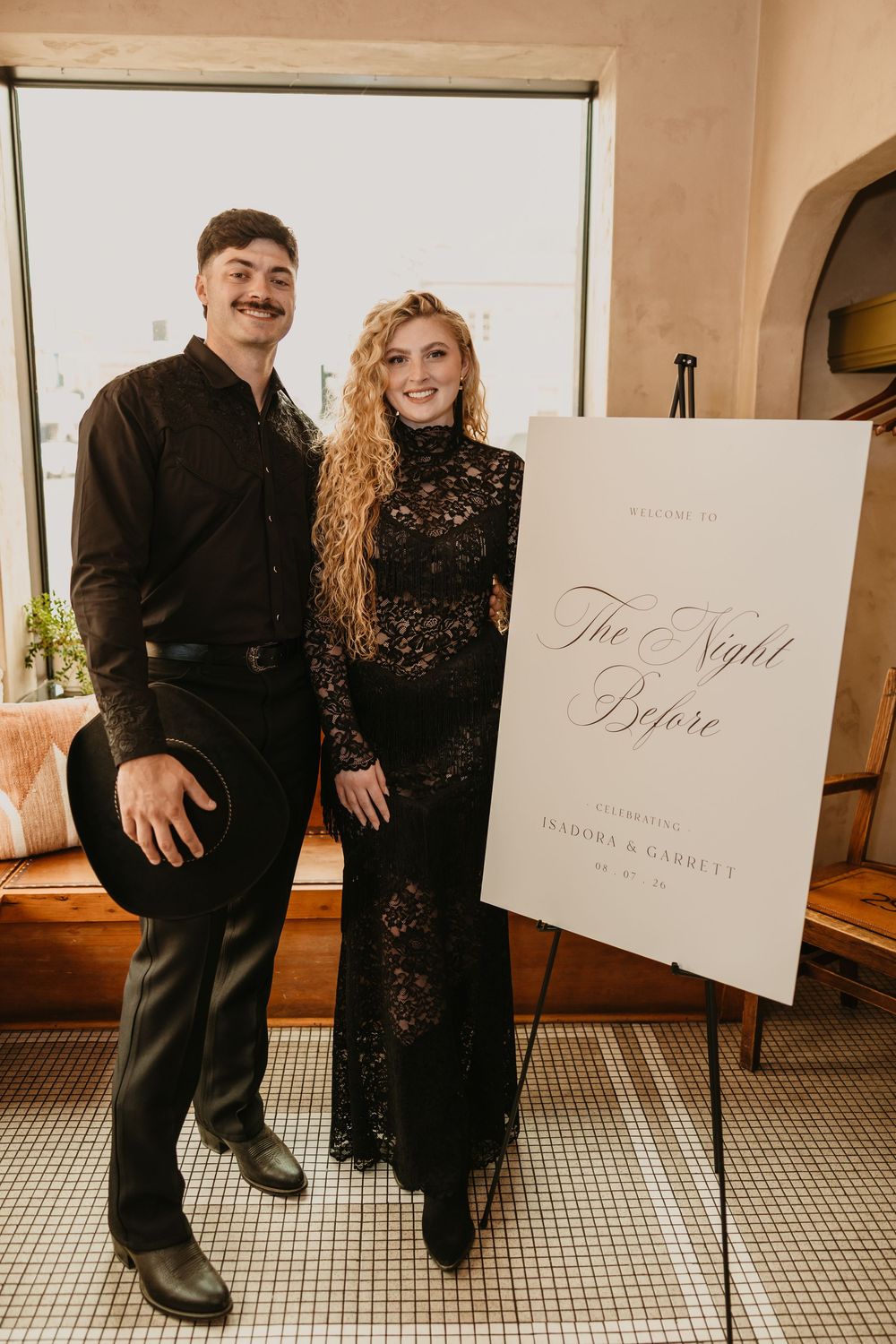 Couple stands at their welcome to the Night Before at the 2nd Street Bistro in Livingston, Montana for their wedding Welcome party