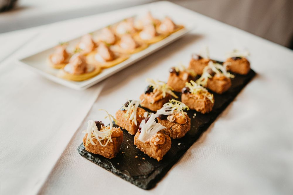 Elegant appetizers, featuring bite-sized gourmet canapés garnished with microgreens at a catered event at 2nd Street Bistro Livingston MT