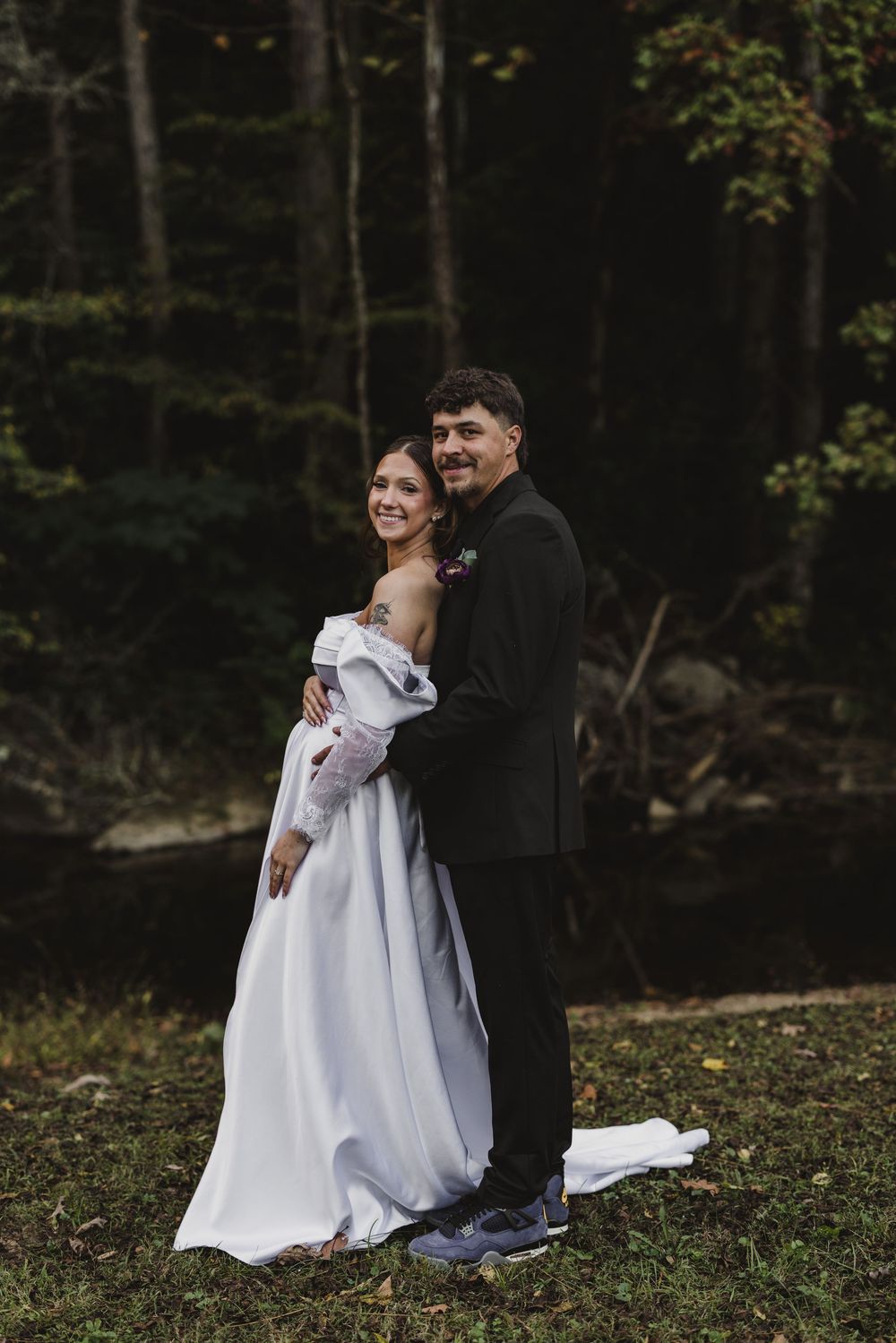 Newlyweds photographed against the natural landscape at The Pearl of the Valley in East Tennessee