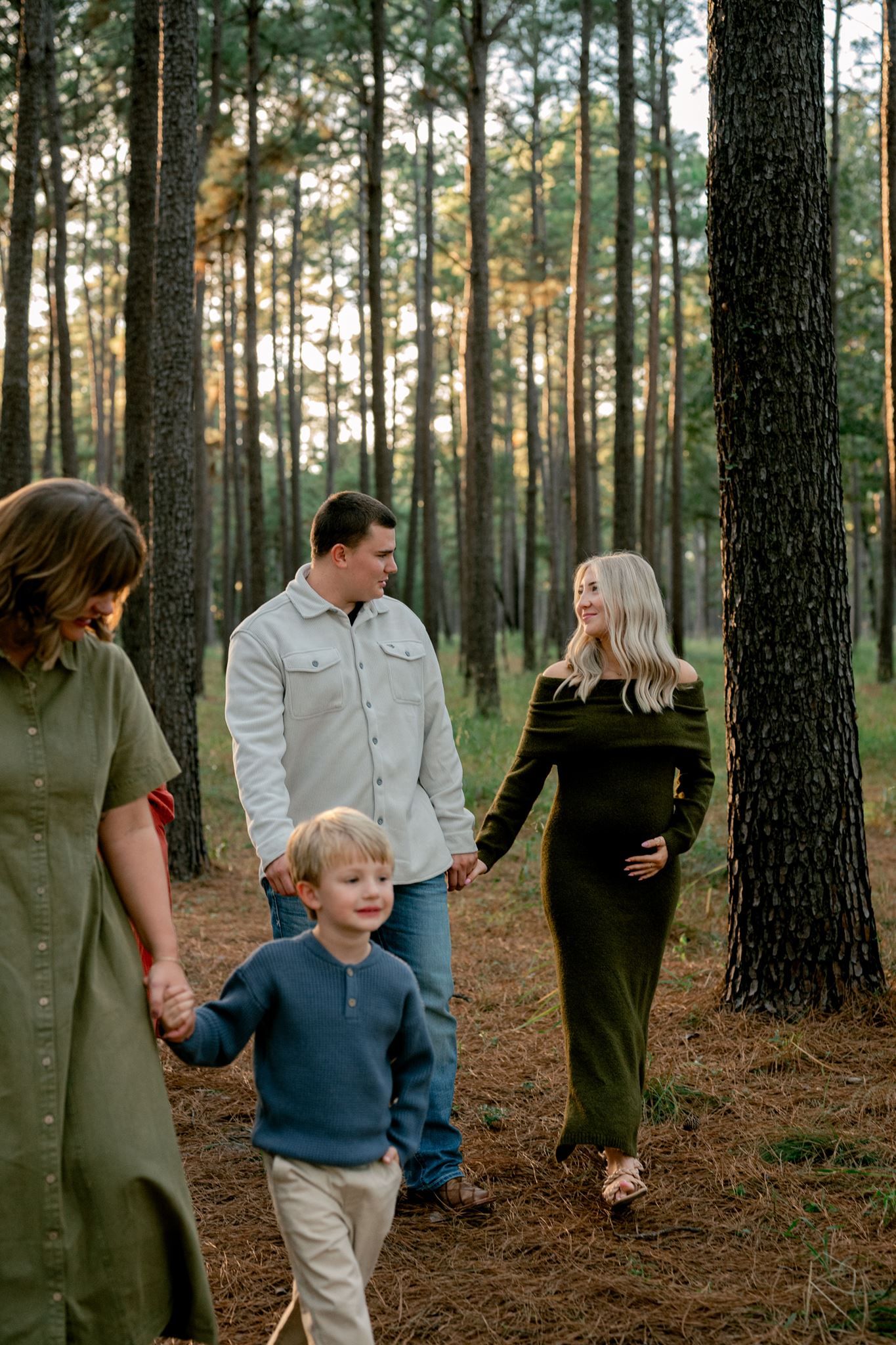 Candid photograph of family members walking together at WG Jones Forest.