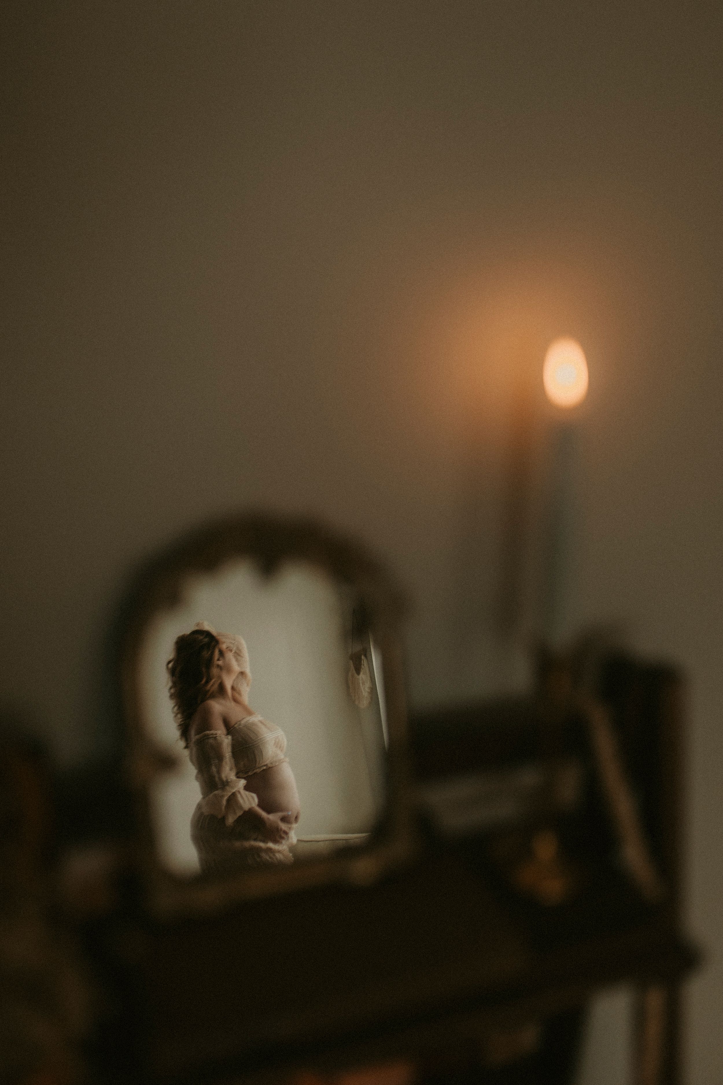 A series of dark moody photographs showing a figure silhouetted against window light in various contemplative poses.