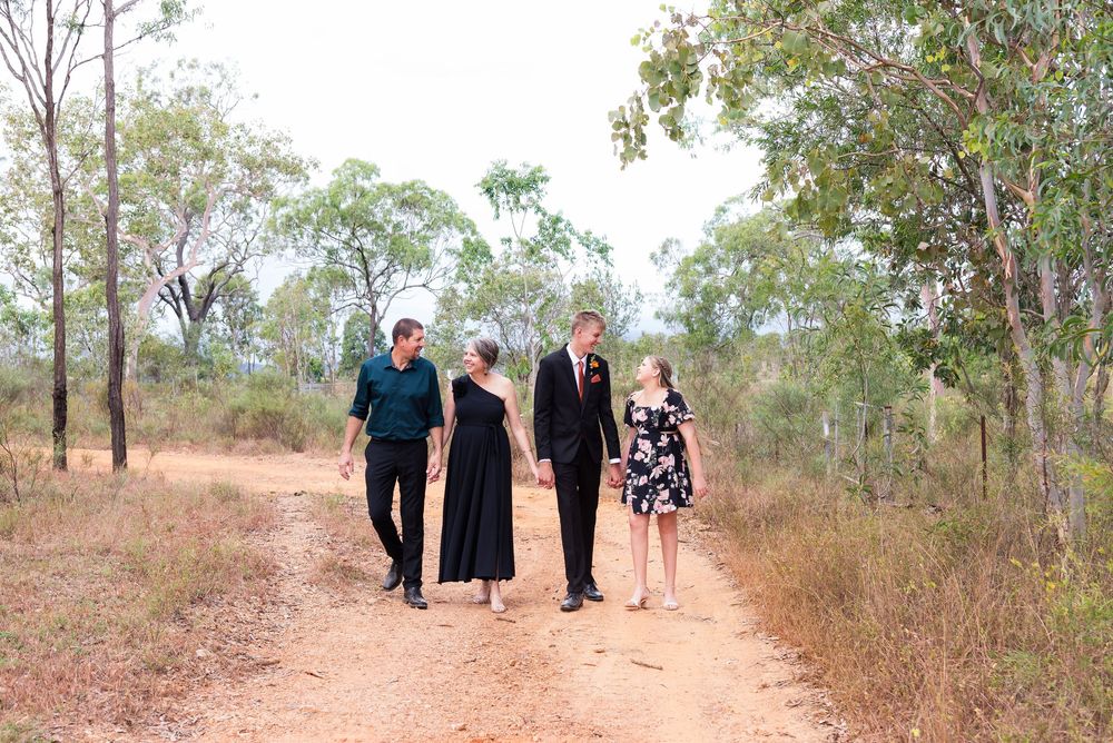Panoramic family group photo taken in an Australian bush landscape with eucalyptus trees.
