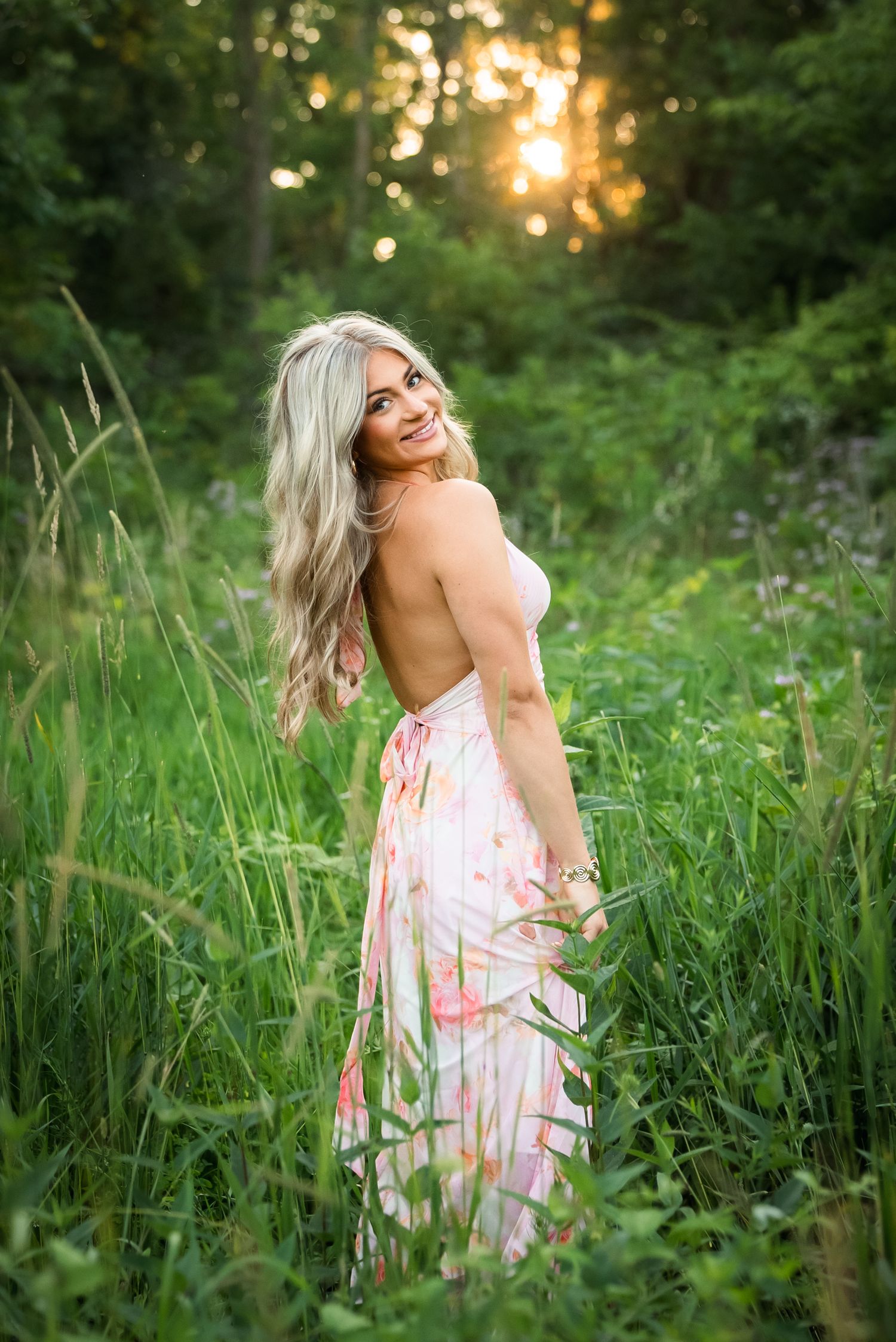 A series of outdoor portraits showing joyful movement in a sunlit meadow with tall grass and golden hour lighting.