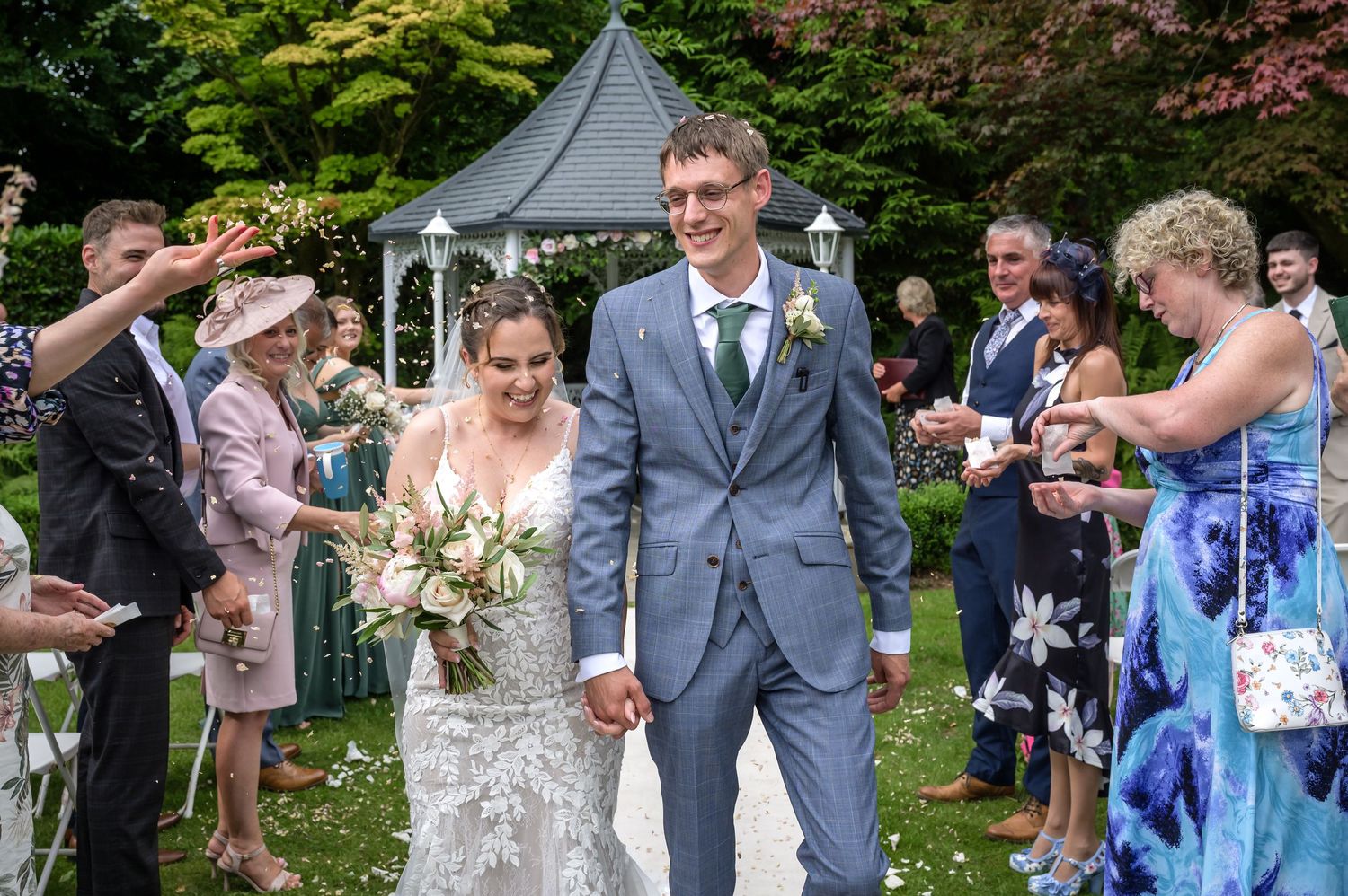 Confetti exit after outdoor wedding at Broadoaks Country House Hotel