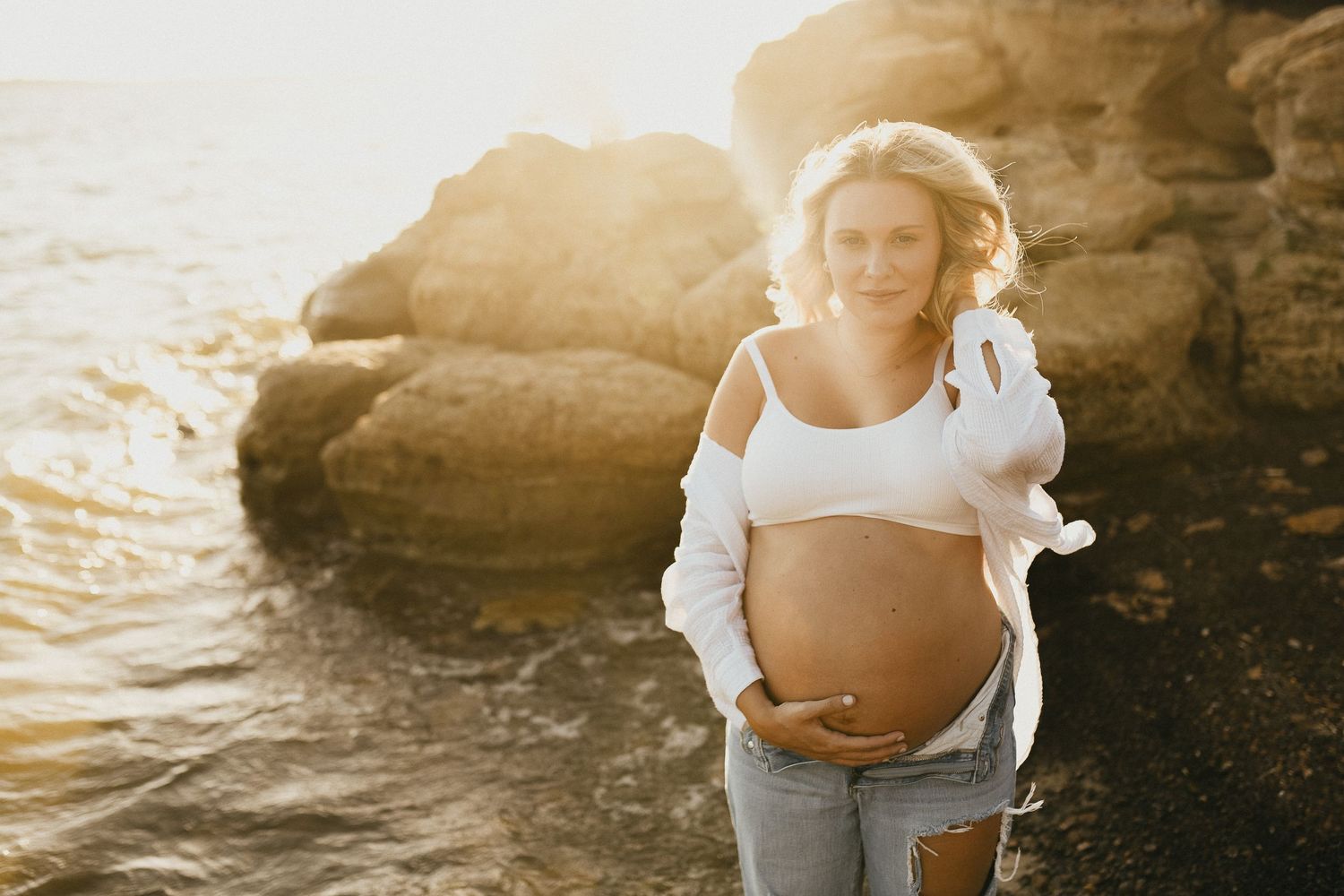 Mom showing her baby bump during a casual summer maternity session at Lake Grapevine