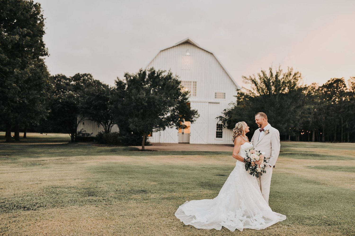 Romantic fall wedding portraits of bride and groom outside The White Sparrow chapel