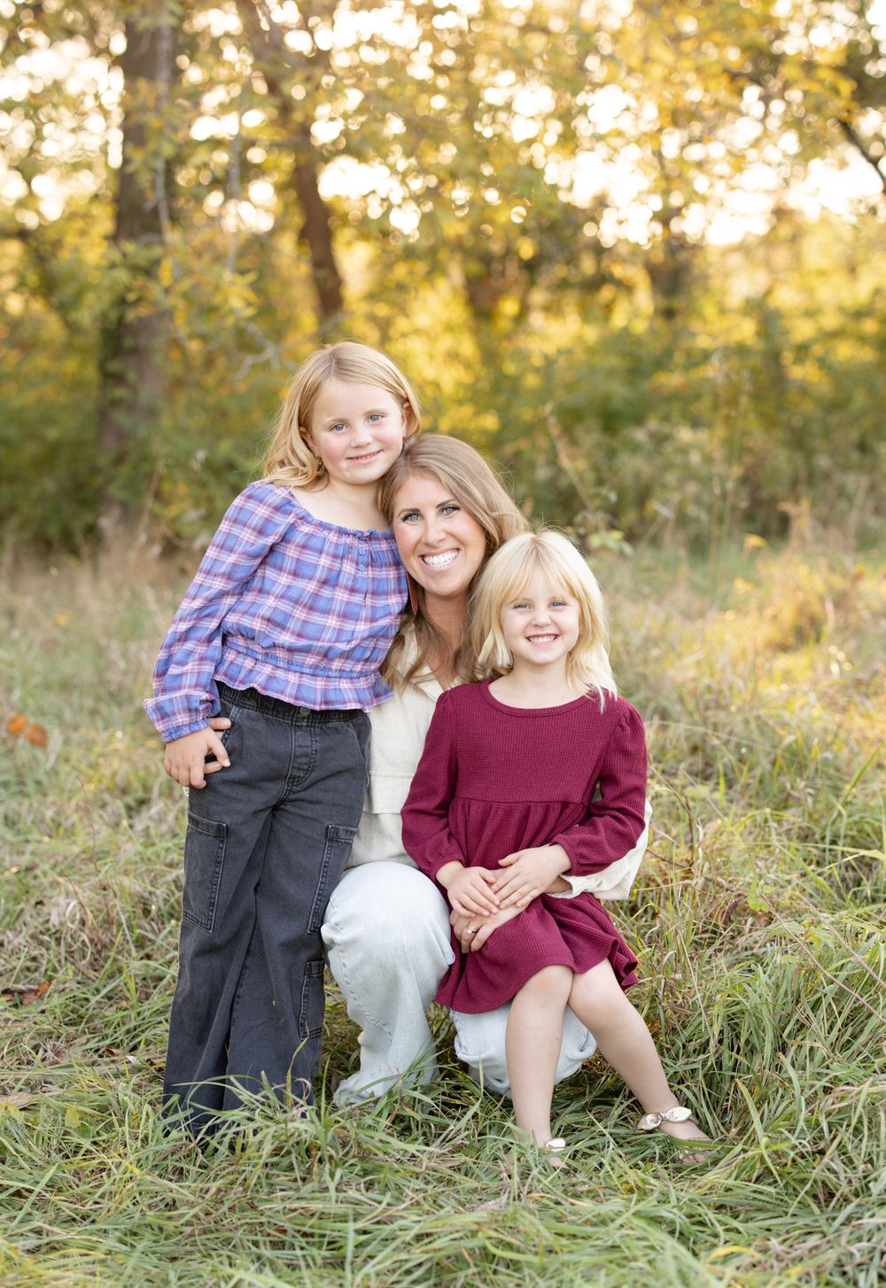 Siblings smiling together during an outdoor family photography session in st. Louis