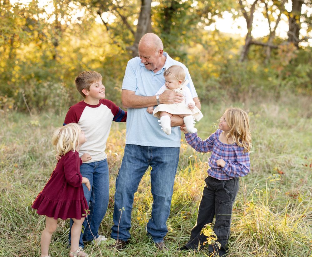 Grandparents posing with their grandchildren during an extended family photography session