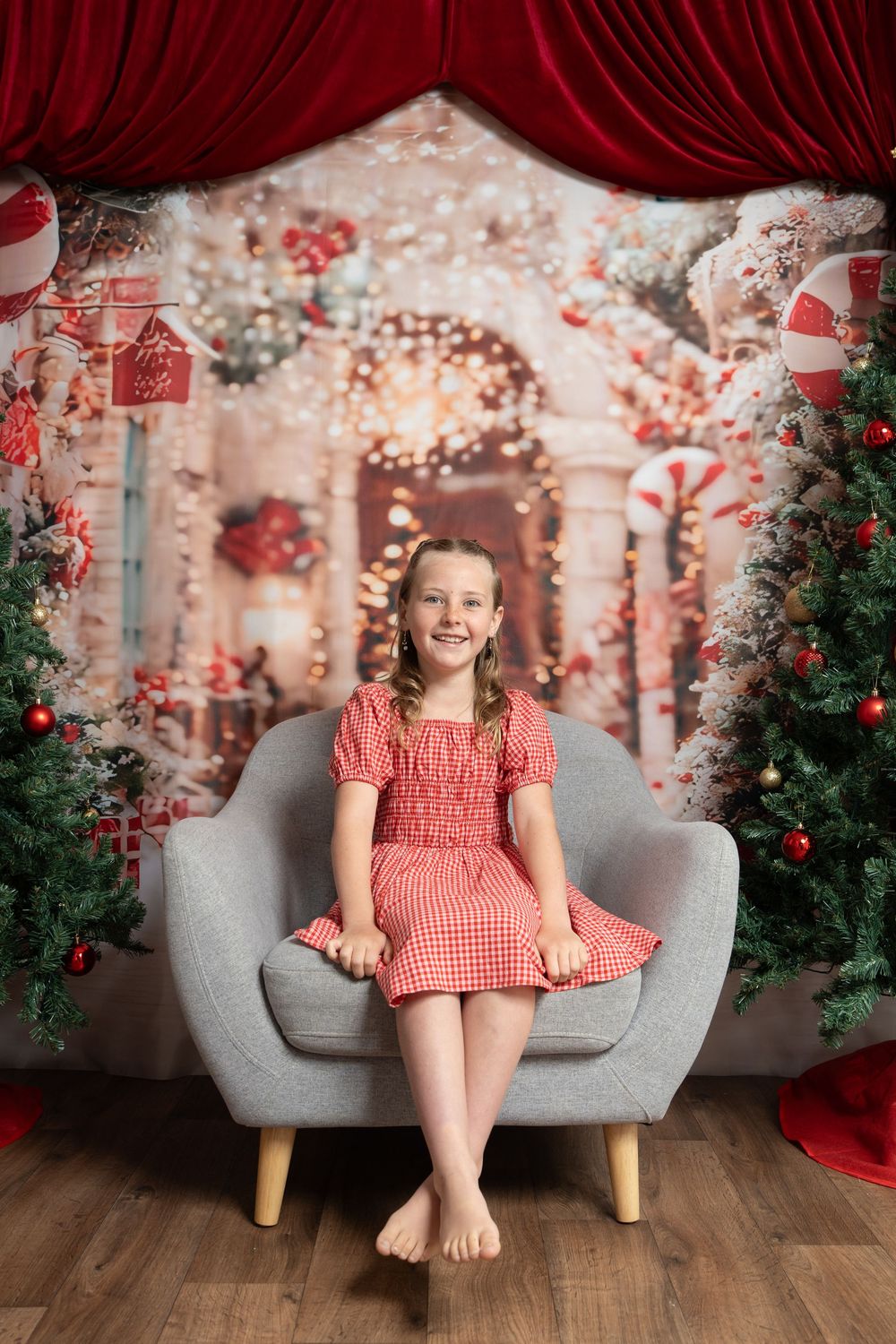 girl on grey chair Christmas photo