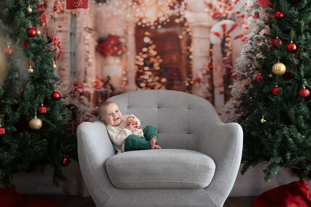 Baby on grey chair Christmas mini photo session