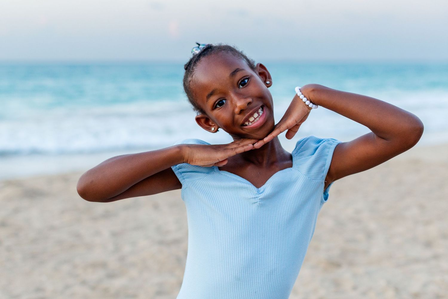 Portrait of a little girl on the beach in Isla Verde, Carolina, Puerto Rico.