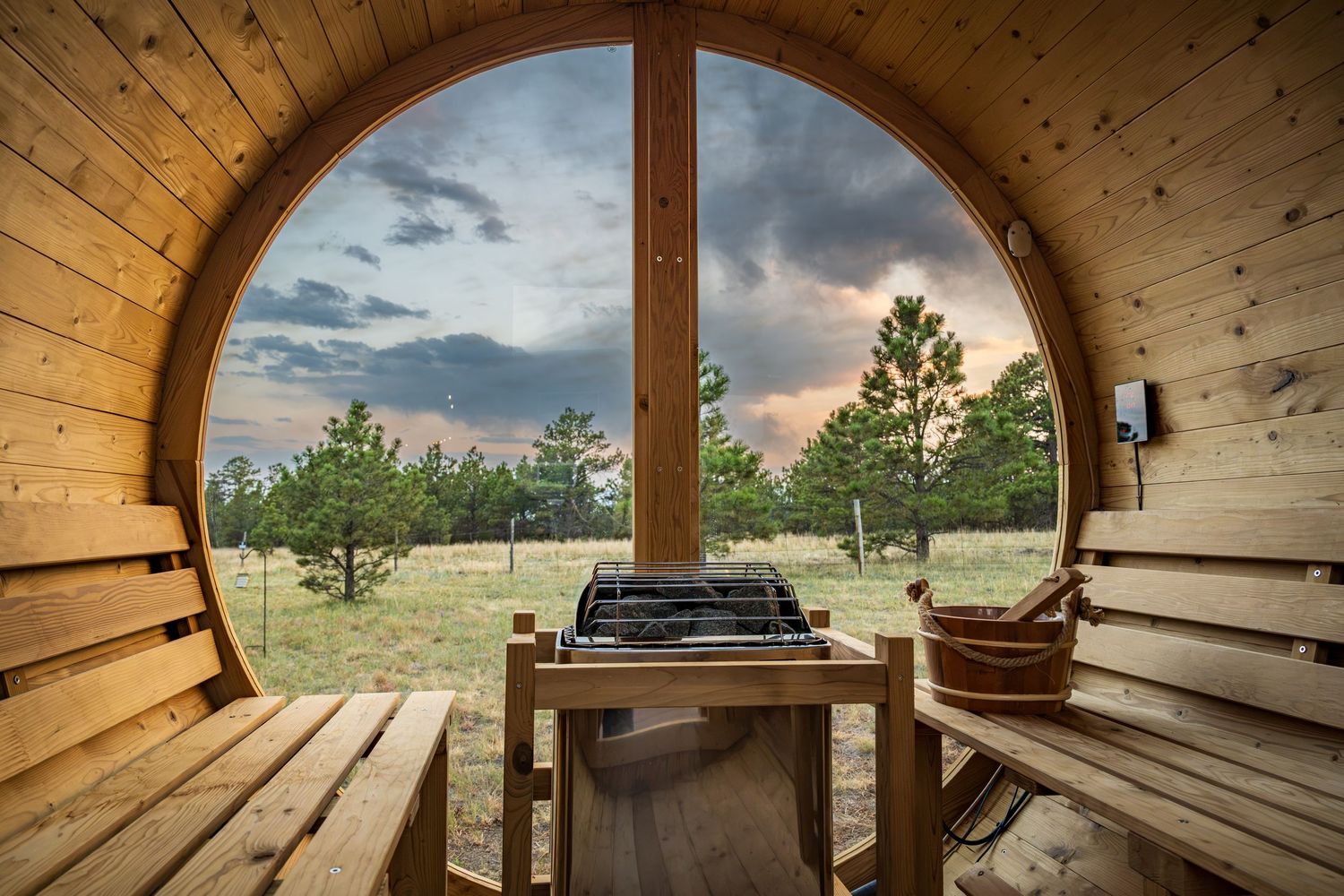 View from a sauna of a beautiful sunset at the short term rental property, The Wild Finch in Black Forest, CO.