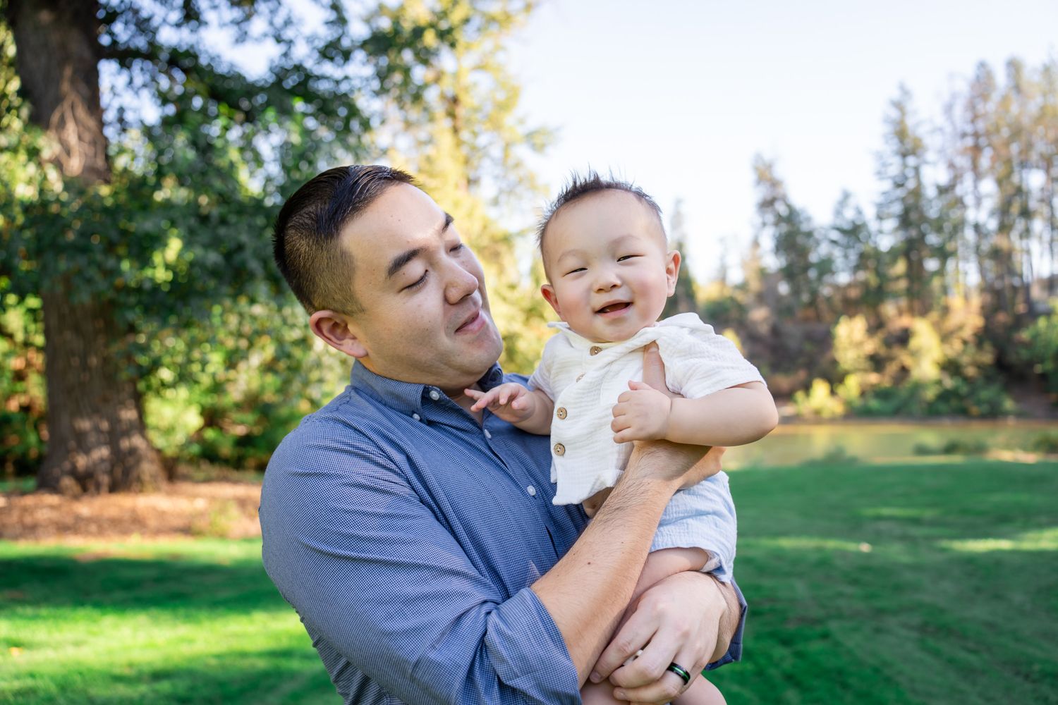Dad laughing with baby boy