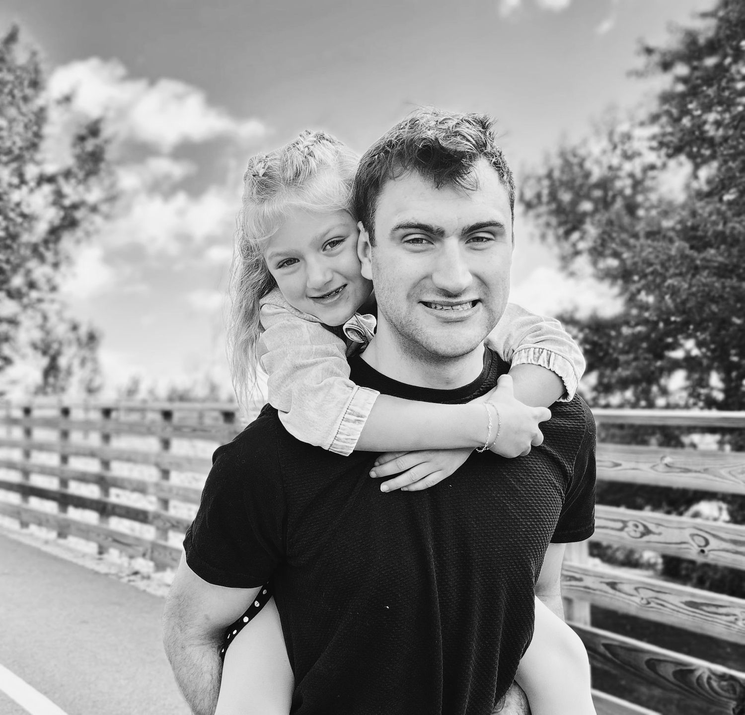 Father and daughter smiling during family photography session