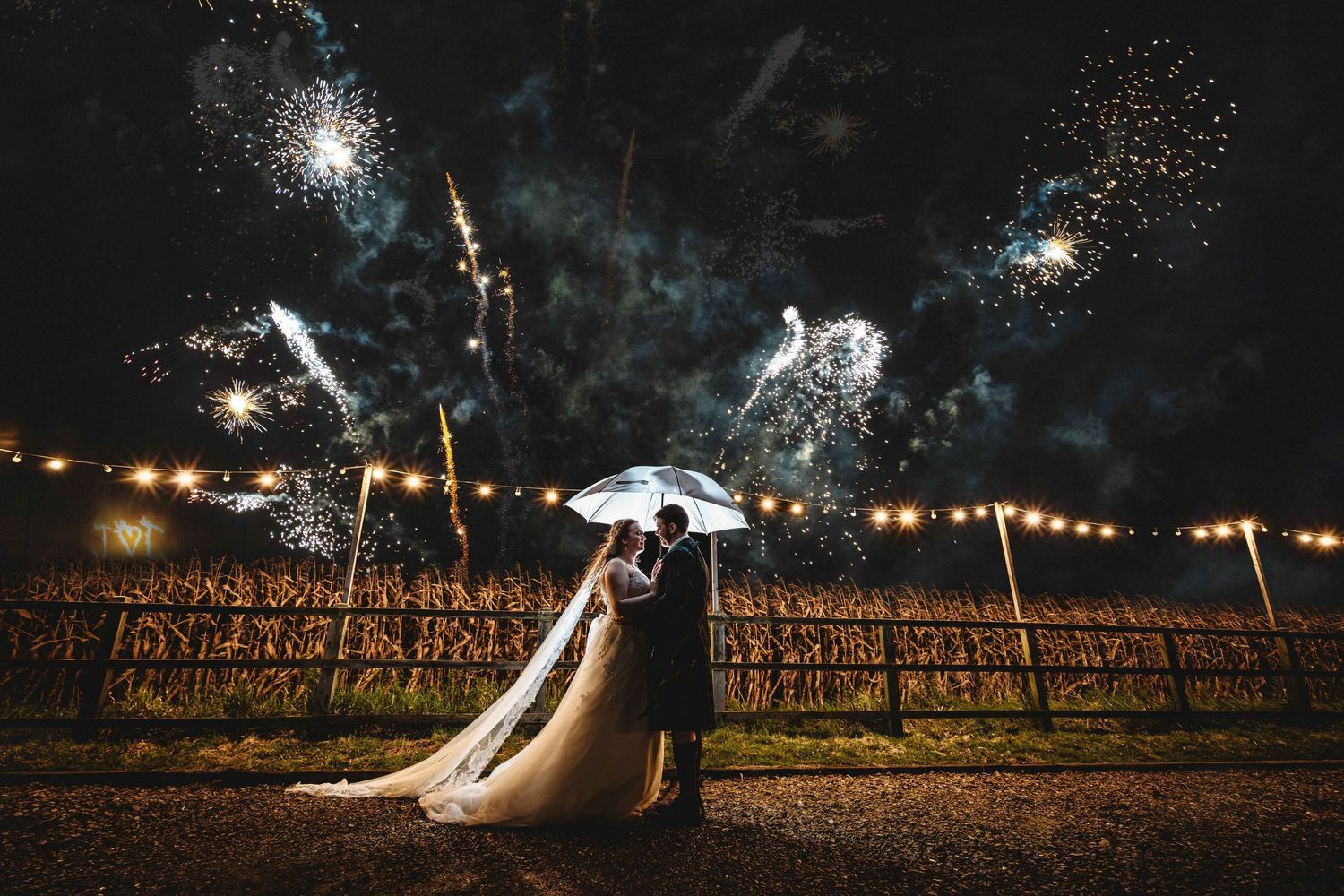 Creative nighttime portrait of a newly married couple at Swancar Farm