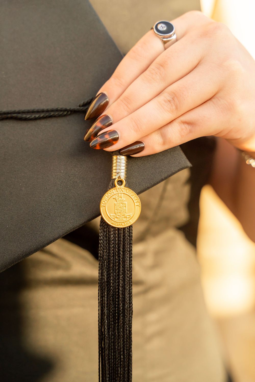 Towson University graduation cap and tassel
