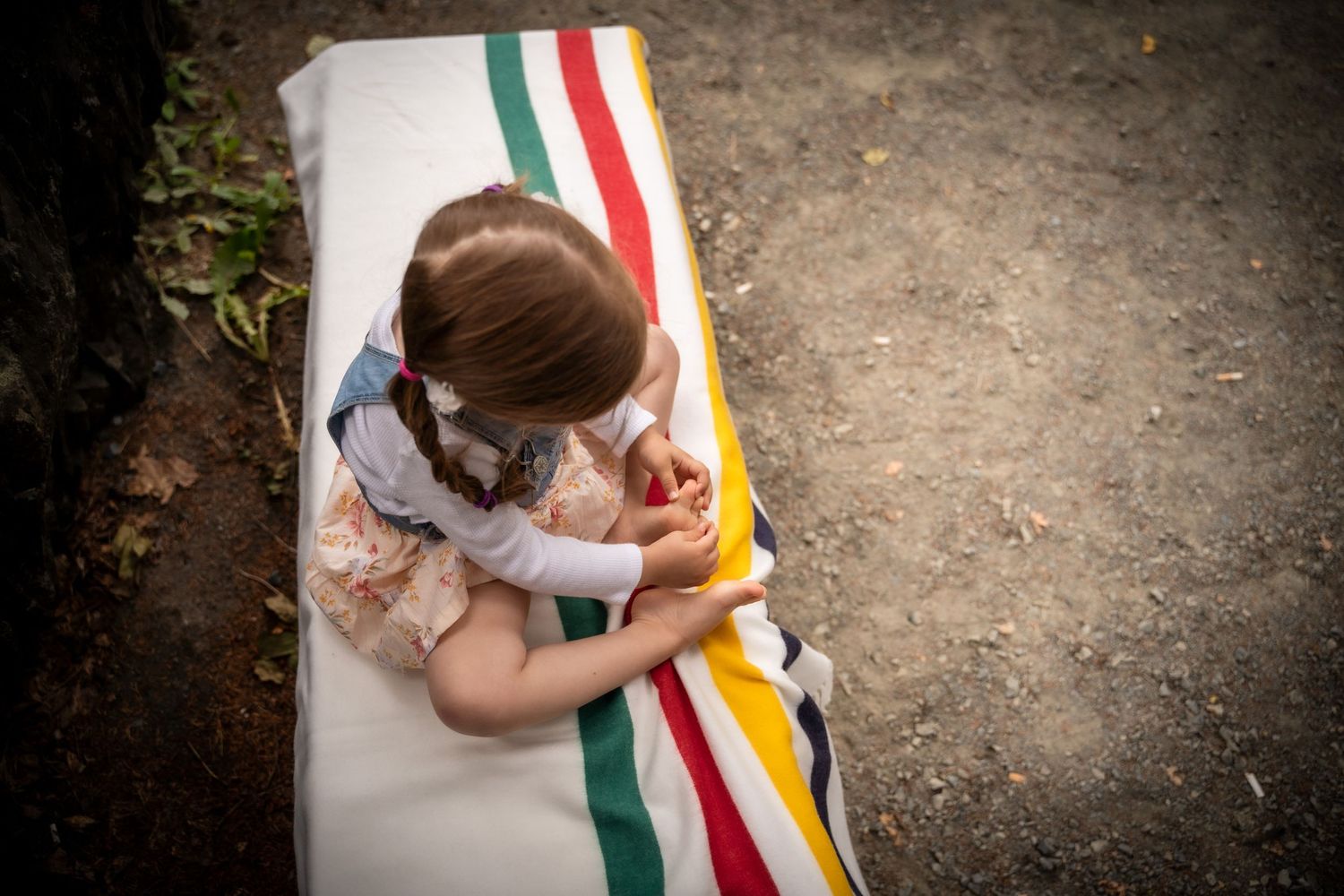 A brief pause during a family photoshoot at Bowring Park, Newfoundland, with the bay's signature blanket and a girl