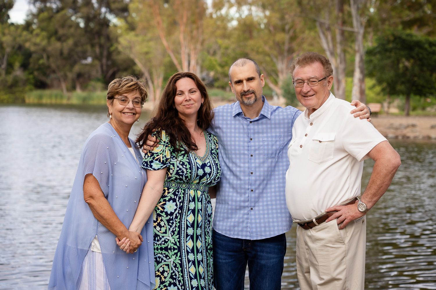 A family poses in front of Vasona Lake in Los Gatos