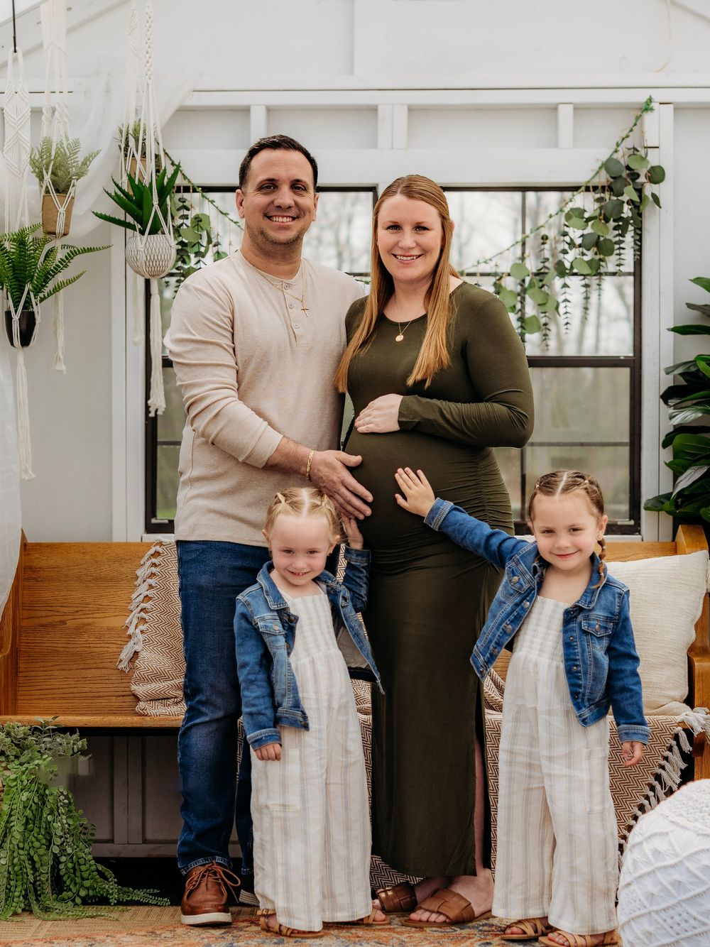 Family of four together during a relaxed indoor South Jersey family photography session.