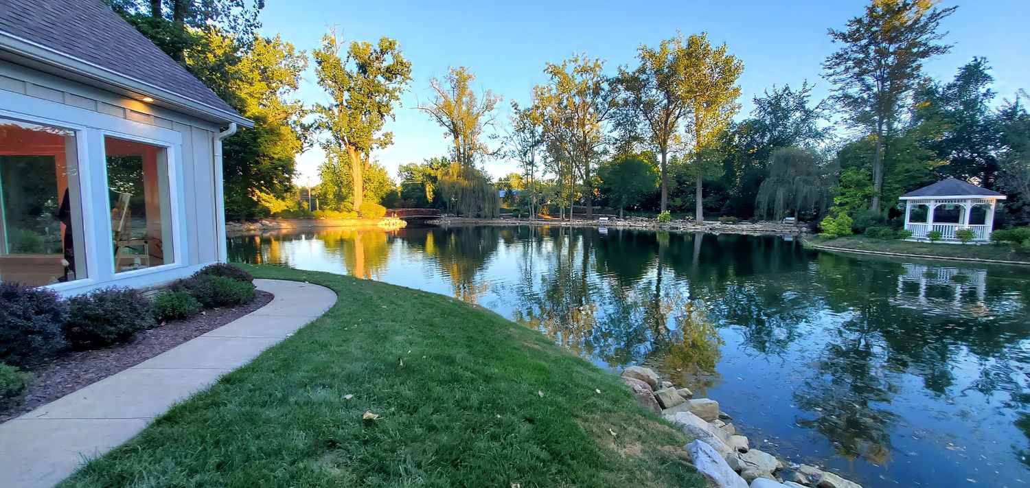 Serene backyard pond of Swan Lake Event Center Wedding Venue