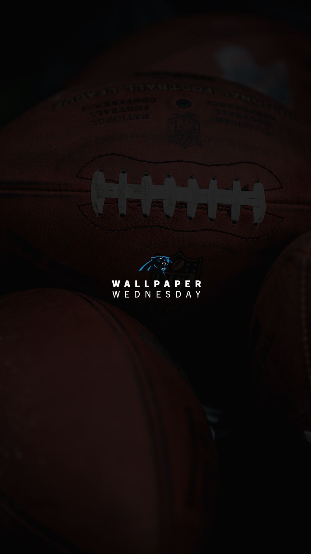 Carolina Panthers Wallpaper Wednesday featuring close-up of NFL footballs on dark background.
