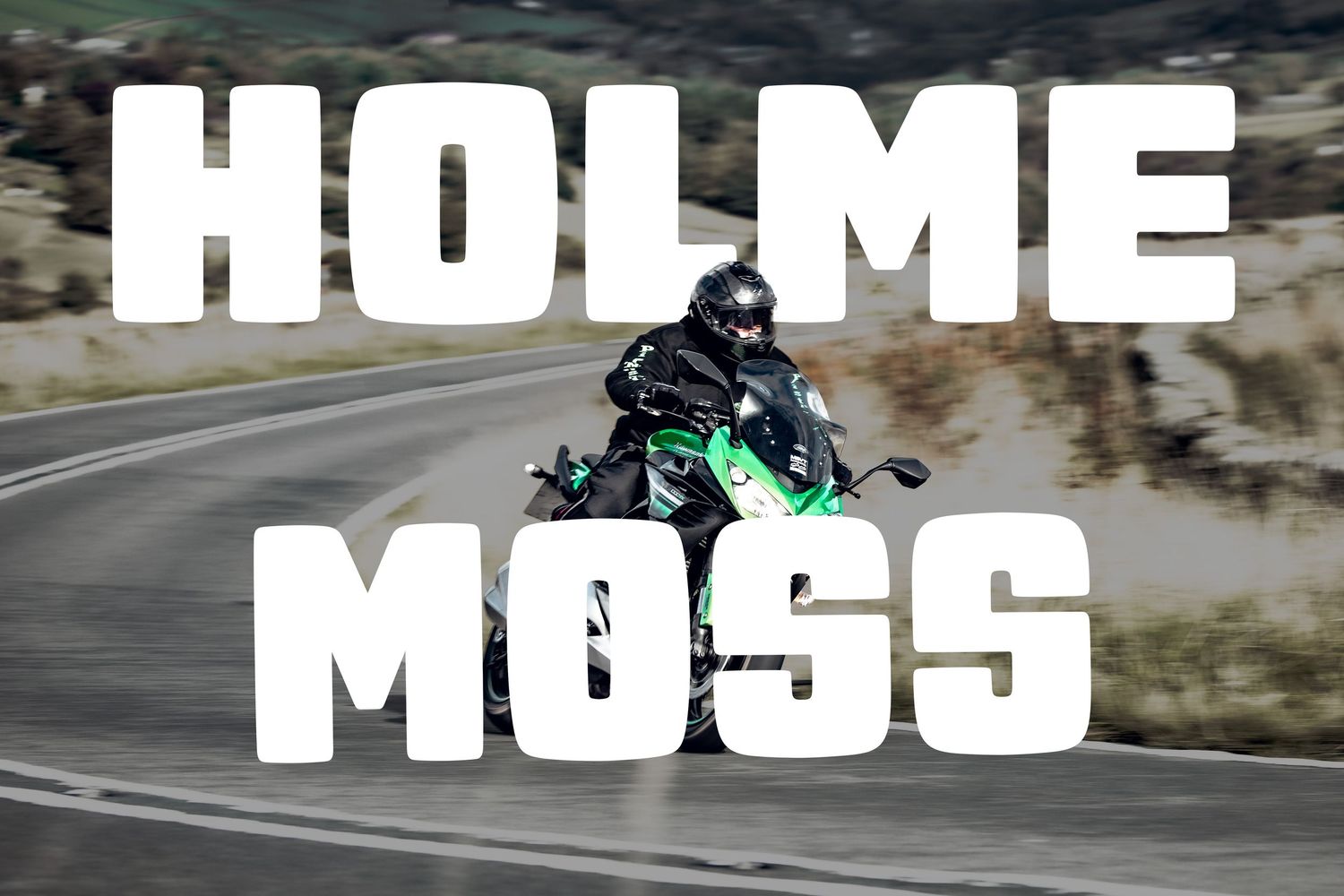 A motorcyclist rides a Monyash B5055 bike on a rural country road with another rider visible in the distance.