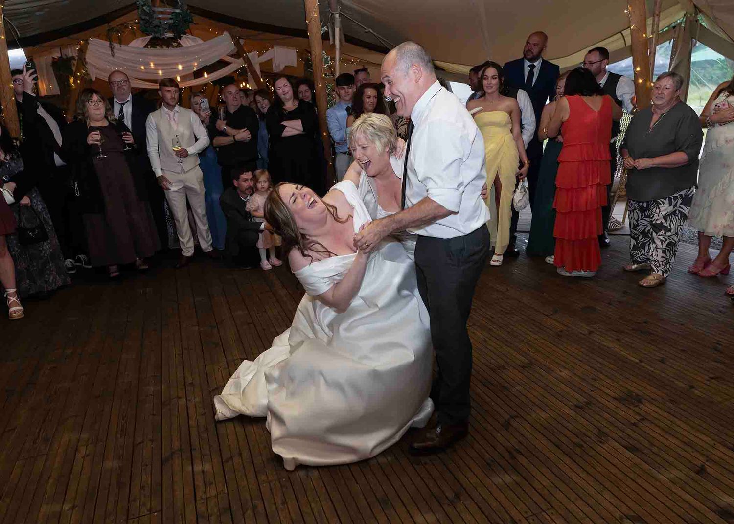 Bride and parents share the festival vibe like experience of a tipi wedding at the den at four acre - near wigton cumbria