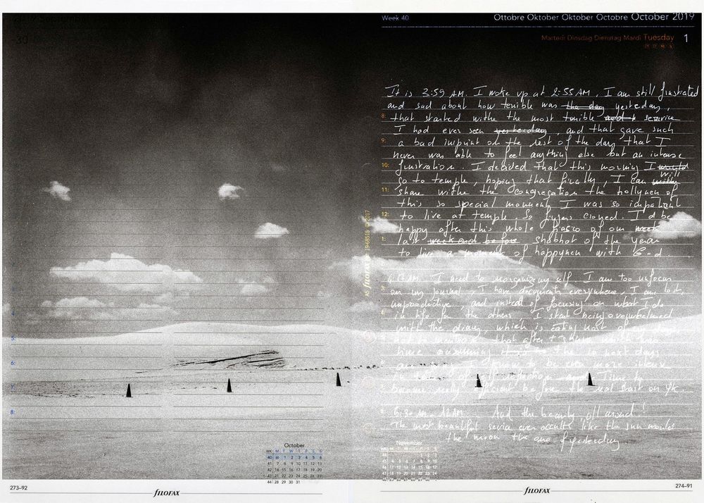 Surreal black and white landscape with handwritten text overlay, clouds, and calendar elements in artistic composition.