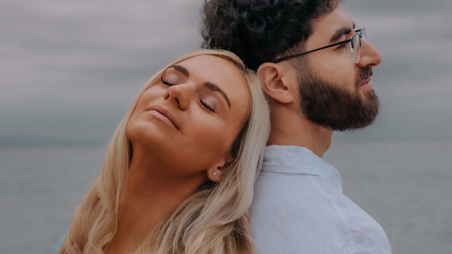 An elegant engagement portrait of a couple embracing warmly