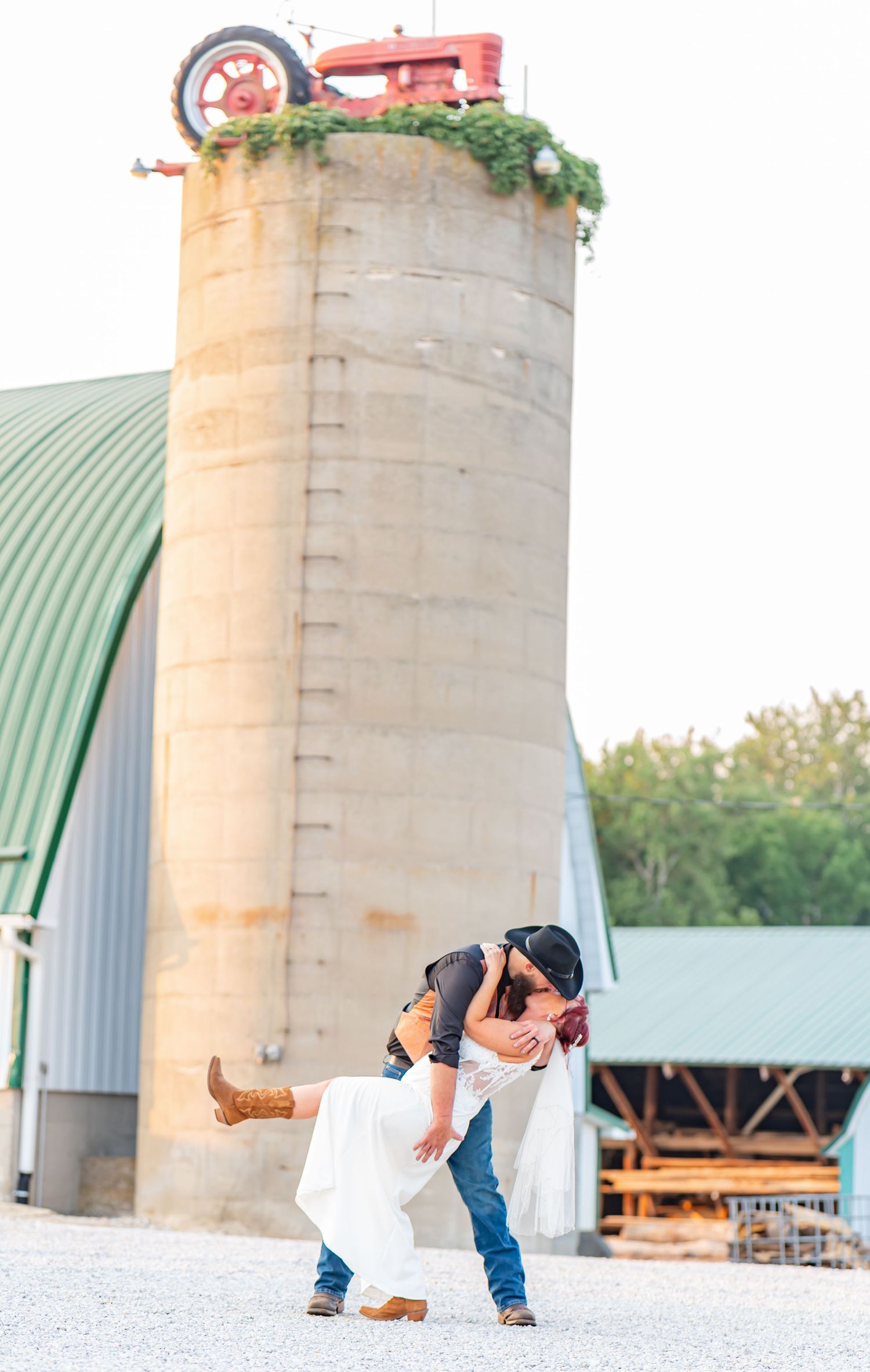 Newlywed couple sharing a romantic dip pose during their first dance.