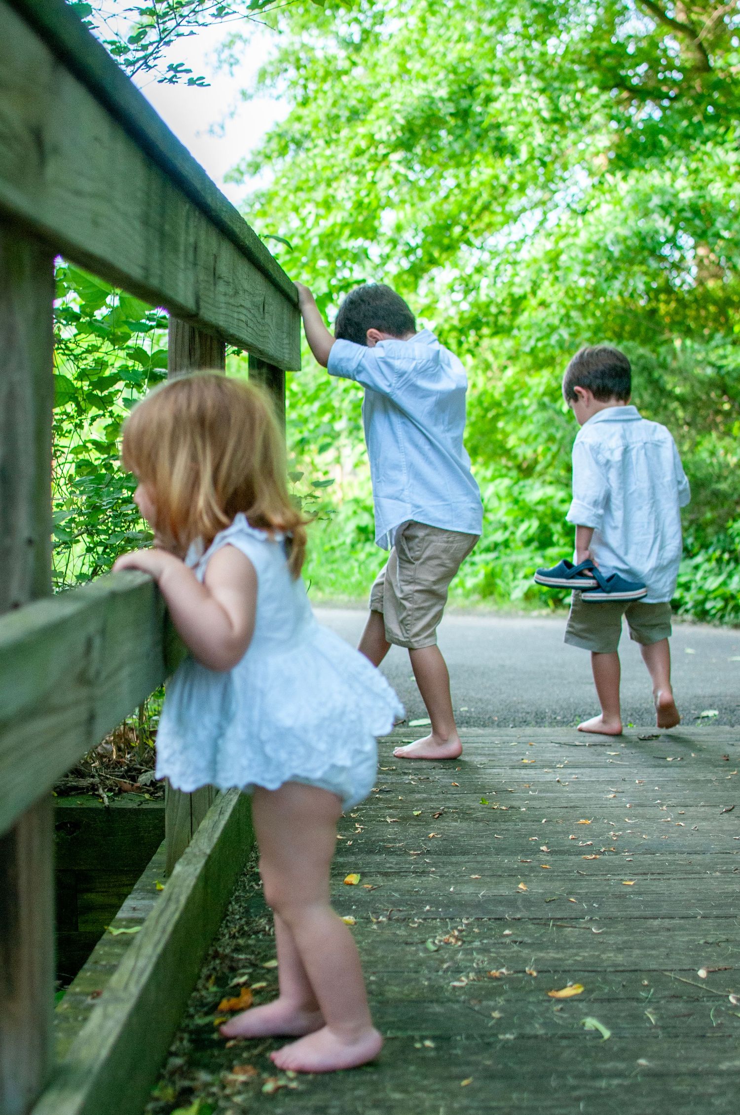 Candid image of young siblings exploring park