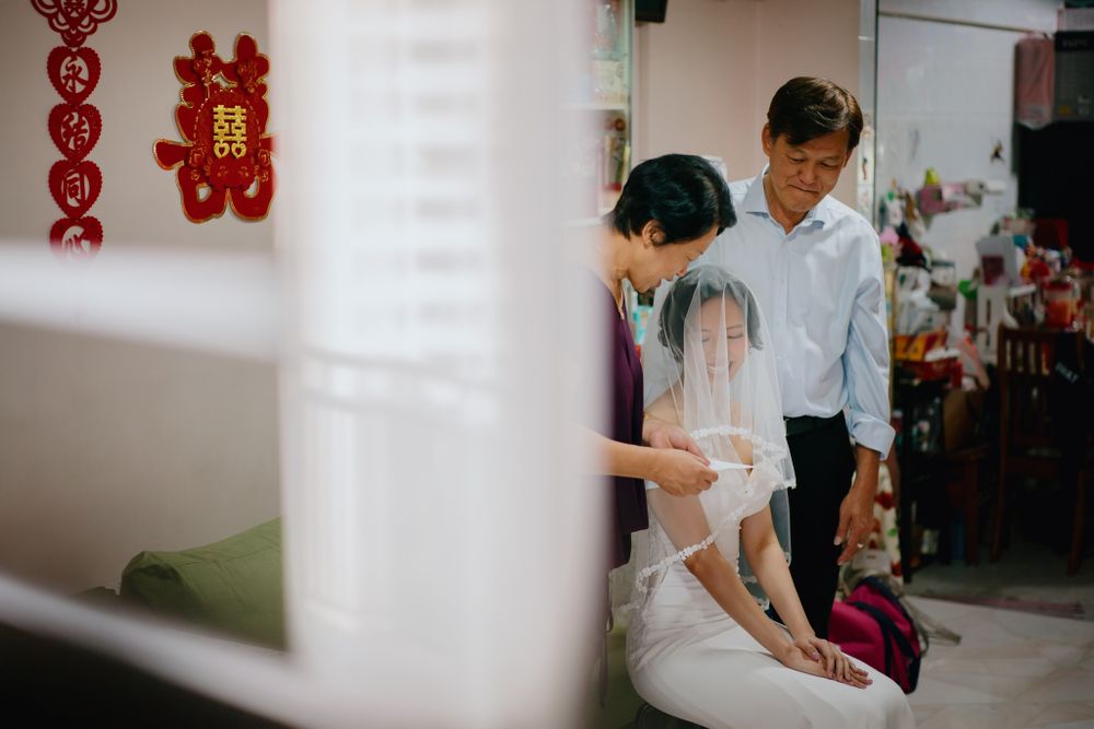Wedding preparation scene in a traditional Asian home interior.