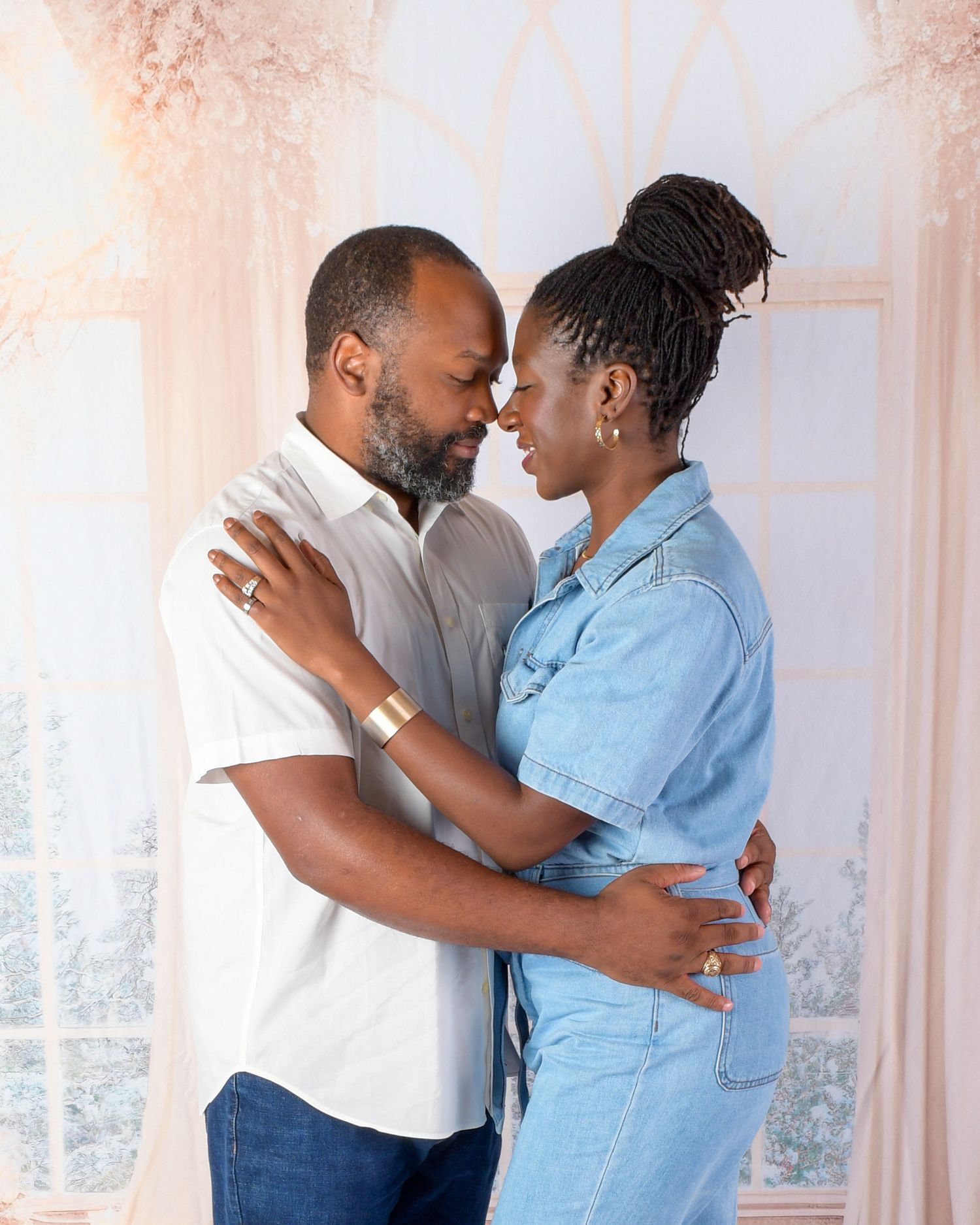 Romantic moments captured in a series of tender embraces against a soft interior backdrop.