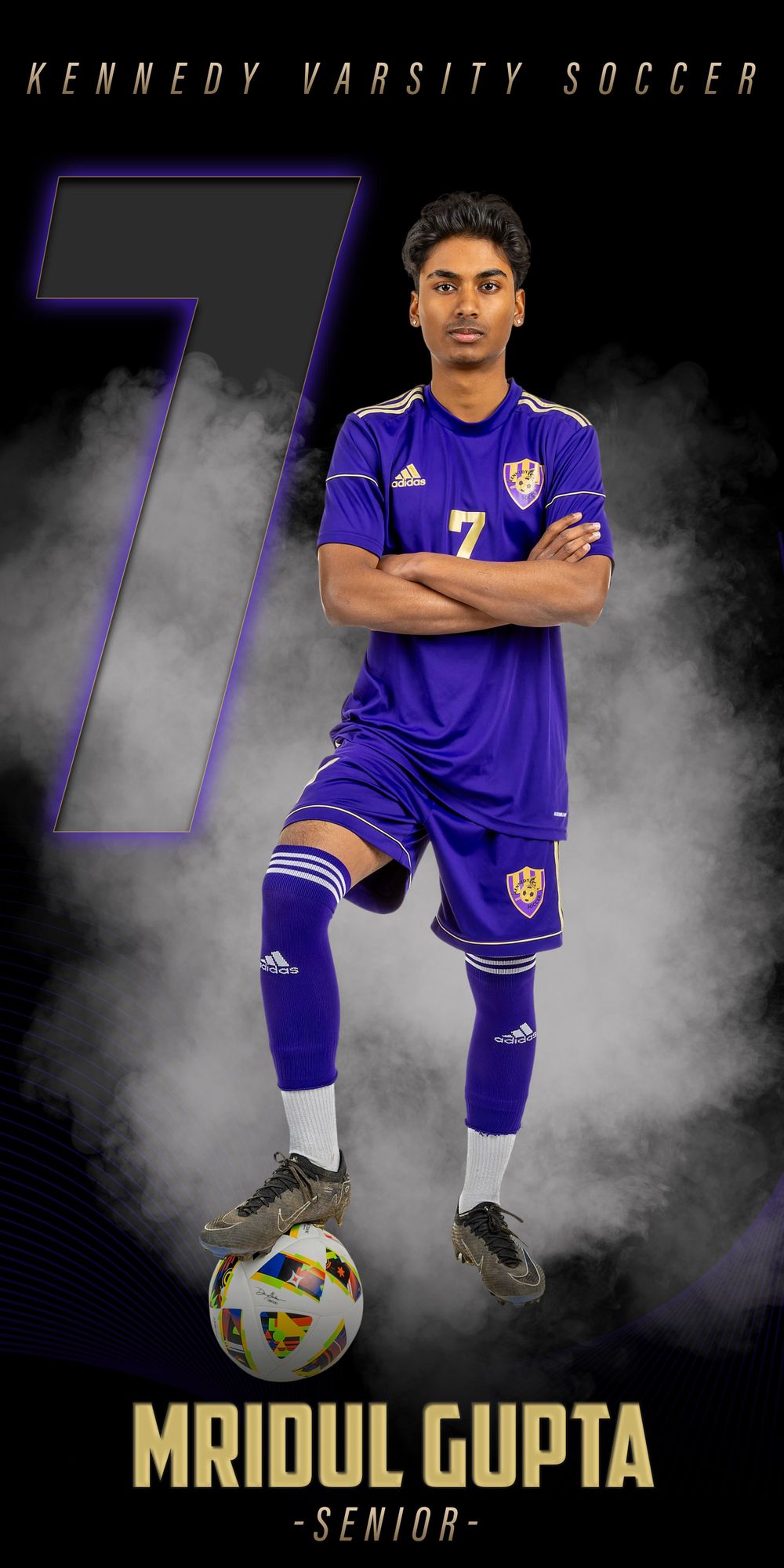 Soccer player in purple Kennedy uniform standing with ball against dark background.
