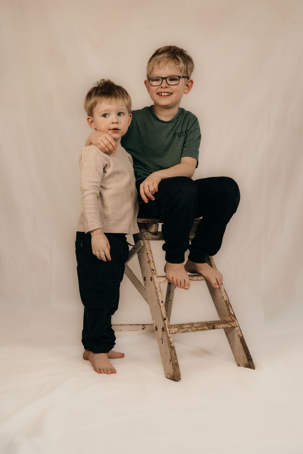 Brothers together in a studio photoshoot.