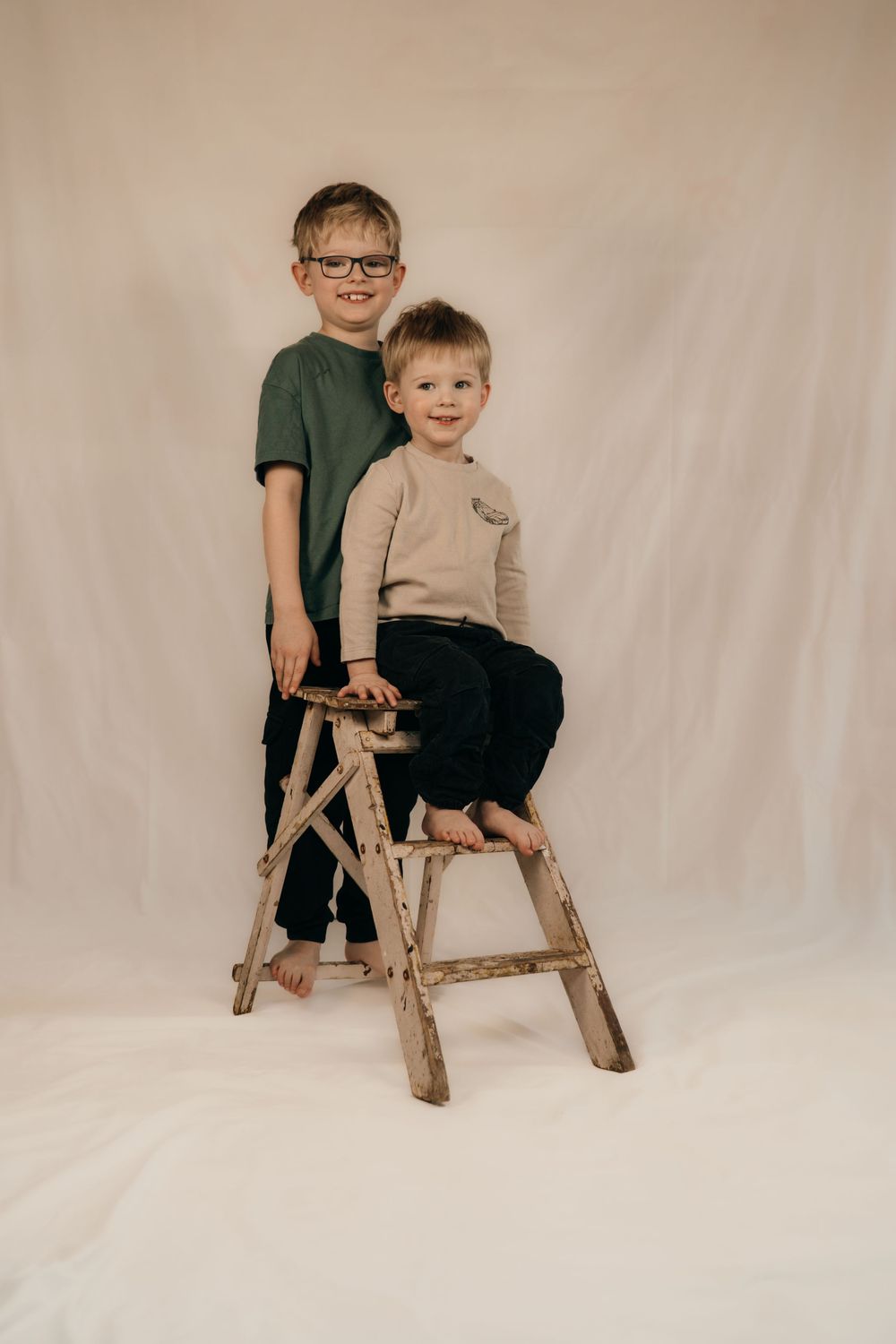 Brothers together in a studio photoshoot.